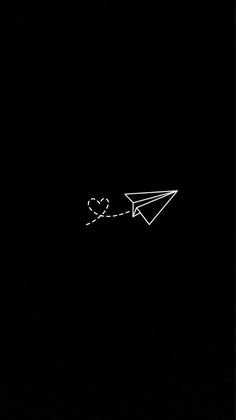 an airplane is flying in the dark with a heart on it's tail,