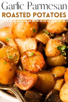 garlic and parmesan roasted potatoes in a white bowl with a fork on the side