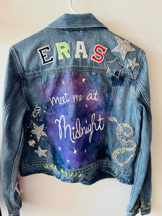 a denim jacket with the words eras written on it and stars painted all over it