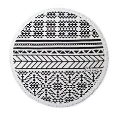 a round rug with black and white designs on the front, in an oval shape