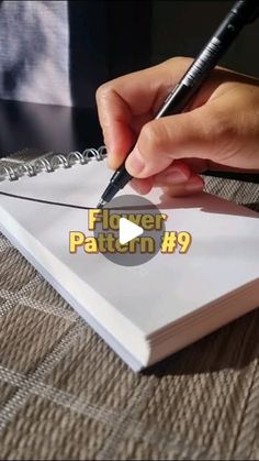 a person writing on a piece of paper with a pen in their hand and the words fliers pattern 9