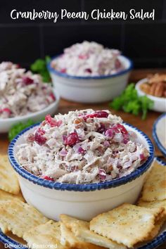 cranberry pecan chicken salad in a bowl with crackers on the side