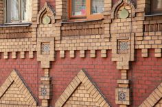 a red brick building with some windows on it