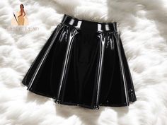 Step into the spotlight with our Women's Flared Mini Skirt. This eye-catching piece is made from glossy patent leather and designed to make a bold statement wherever you go. The flared design adds a playful touch, making it perfect for dancing or enjoying a night out. Its sleek and shiny finish enhances your look, ensuring you stand out in any setting. Pair it with your favorite top and heels for an unforgettable outfit. Size Notice: 📏 The size chart is smaller than the regular size. Please add 2-3 cm to your measurements when selecting your size to ensure the perfect fit. Refund & Returns: 🔄 We accept refunds if the item arrives defective, up to 7 days from the date of delivery. Please note that we do not accept returns for any damages caused by the buyer. Processing & Delivery: 🚚 We p Black Latex Mini Skirt, Flared Mini Skirt, Patent Leather, Sleek, Night Out, Womens Skirt, The Selection, Perfect Fit, Mini Skirts