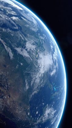 the earth as seen from space with clouds and land on it's sides, in blue hues