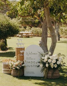 an outdoor wedding ceremony setup with flowers and candles