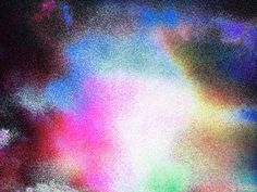 blurry photograph of the sky and clouds with different colors in it, including blue, green, pink, yellow