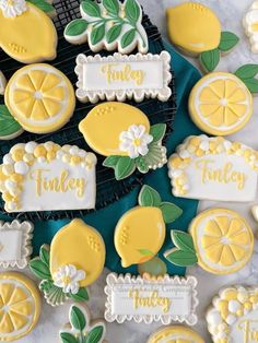 decorated cookies with lemons and leaves on them