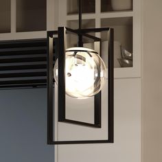 An UHP3251 Minimalist Pendant Light with a glass globe hanging from it, providing a unique touch to any space. Candle Box Design, Minimalist Pendant Light, French Country Modern, Pier Light, Minimalist Pendant, Fan Lamp, Candle Box, Midnight Black, Construction Materials