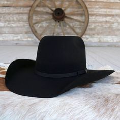 Introducing the Resistol Hooey Day Money cowboy hat, crafted with durable 4X Wool Felt for rugged authenticity. From the Hooey Collection, it features a striking 5 1/4" Bullrider Crown and a classic 90 Profile, embodying the spirit of the West. Complete with a distinctive Hooey Hatpin and a 4 1/4" Brim, it's your go-to for rodeos, ranching, and everyday adventures on the range. 4 1/4" Brim 5 1/4" Bullrider Crown Color: Black 4X Wool Cowboy Hat Black, Felt Cowboy Hat, Felt Cowboy Hats, Everyday Adventures, Black Felt, Felt Hat, Cowboy Hat, Wool Hat, Black 7