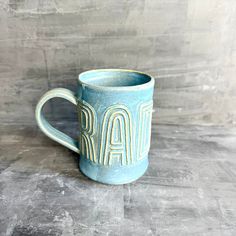 a ceramic mug with the word mar written on it