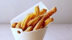 some fried food in a white bowl on a table