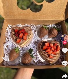 three heart shaped waffles with strawberries in the shape of hearts on top