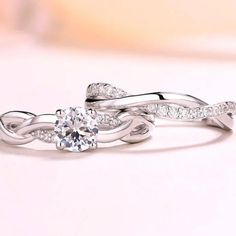 two white gold rings with diamonds on them