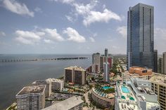 an aerial view of the ocean and city from a high rise building in miami, florida