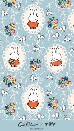 a blue background with white rabbits and flowers on the bottom, and an orange bowl in the middle