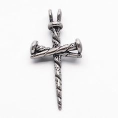 a silver cross on a white background