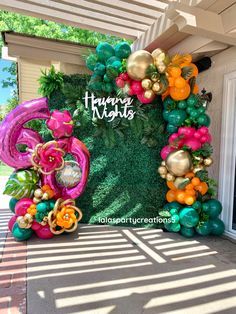 an entrance decorated with balloons and flowers