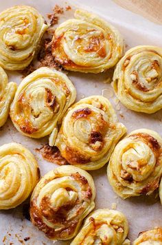 there are many small pastries on the baking sheet