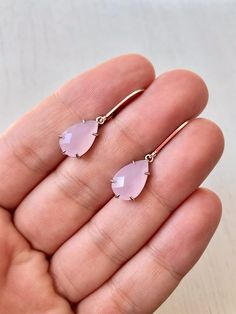 Rose Quartz Earrings, Pink Teardrop Earrings, Blush Pink Earrings, Small Dangle Earrings, Rose Quartz Gold Jewelry, Gift for Mom, Girlfriend These small but gorgeous earrings feature soft pastel pink rose quartz faceted teardrops bezel framed in gold filled. The teardrops are suspended from gold filled lever back ear wires. These are understated, delicate and dainty earrings but with a gorgeous soft and neutral color sure to match many outfits. Ideal for a girl or a women that likes light weight Rose Gold Pierced Teardrop Earrings For Gift, Pink Drop Earrings With Ear Wire, Pink Long Drop Earrings As Gift, Feminine Teardrop Earrings For Gifts, Feminine Teardrop Earrings As Gift, Dainty Rose Gold Teardrop Dangle Earrings, Pink Hypoallergenic Teardrop Earrings, Rose Gold Dangle Teardrop Earrings With Ear Wire, Feminine Rose Gold Teardrop Earrings