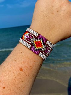 a person wearing a bracelet on the beach