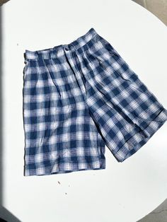 A pair of vintage plaid shorts in blue flannel. High waisted fit with a smocked waistline in back for easy and comfortable fit and a cuff at bottom with button and zipper closure. In great vintage condition with no rips tears or stains. Fabric rayon and linen. Waist26 rise 14 inseam 8 Cream Wool Coat, Physical Manifestation, 90s Flannel, Flannel Shorts, Sherpa Vest, Blue Flannel, Plaid Pajamas, Fashion Wishlist, Vintage Plaid