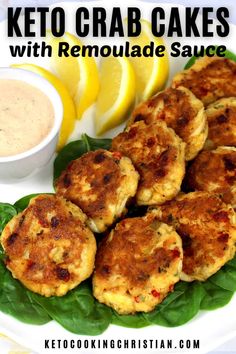 keto crab cakes with remoulade sauce on a green leafy plate