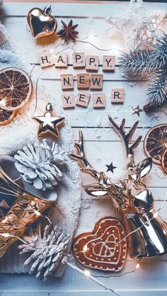 an assortment of christmas ornaments and decorations on a white board with the words happy new year