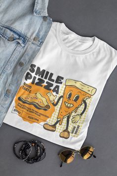 Step into the retro charm of our exclusive "Retro Pizza Bliss" T-shirt - a tribute to the golden era of pizza indulgence! This unique design combines the timeless style of the 80s with an irresistible passion for savory pizza slices. The vibrant, colorful motif showcases a classic pizza slice in a cool retro aesthetic, accompanied by a hint of nostalgia. The rich colors and playful graphics give this T-shirt a distinctive, laid-back vibe, perfect for pizza enthusiasts looking to express their pa Retro Pizza, Food T-shirt, Pizza Shirt Ideas, Pizza Tshirt Design, Pizza Tee Shirt, Pizza Tshirt, Pizza Shirt, Classic Pizza, Retro Shirts