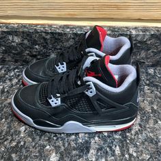 Authentic Air Jordan 4 Retro Bred Reimagined (Gs) 4.5y Boys. Mostly Black With Red White And Grey Details. My Daughter Wore These Maybe 3 Times, And They Sat In Her Closet. They Are In Great Condition. Non Smoking Home. Have A Few Other Kids Jordan Shoes I’ll Be Listing. Questions? Leave A Comment Below! Red Black Shoes, Bred 4s, Jordan Shoes For Kids, Jordan 4 Retro Bred, Red And Black Shoes, Jordan 4 Bred, Kids Jordan, Cholo Style, Grey Jordans