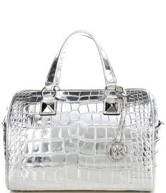 From Michael Kors&#x2C; the Grayson Medium Metallic Crocodile Embossed Leather Satchel Bag features:Metallic crocodile-embossed leatherLining: 100% polyester100% leatherSilver-tone hardwareInterior details: back zip pocket&#x2C; front slip pocketZip fasteningApprox. 11.25"W X 8.25"H X 6.5"DHandle drop approx.: 4.75"Adjustable strap approx.: 19-22.5"Imported. Leather Satchel Bag, Leather Silver, Leather Satchel, Michael Kors Bag, Embossed Leather, Satchel Bags, Handbag Accessories, Adjustable Straps, Zip Pockets