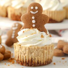 a close up of a cupcake with icing and a ginger man on top