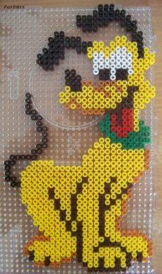 an image of a beaded ducky on a piece of plastic