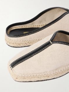 Find TOTÊME Leather-trimmed Canvas Slippers on Editorialist. TOTEME's espadrille slippers are the answer to effortless yet sophisticated summer dressing. They're made from durable canvas and trimmed with supple leather to enhance the squared-off toes. Wear yours with linen sets and floaty dresses alike.