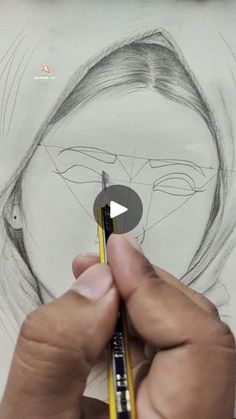 someone is drawing a woman's face with pencils