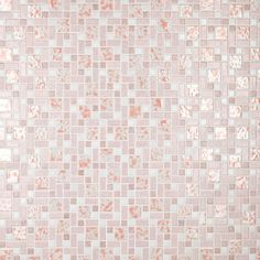 an orange and white mosaic tile wallpaper with small squares on the bottom half of it