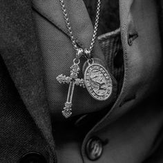 This cross and two-sided brass coin pay tribute to the religious history of the Eye Of Providence, or, as it is more commonly referred to, The All Seeing Eye. Way back when, the eye symbolized God watching over humanity. But these days, most of us just associate it conspiracy-fuelled secret societies and cold, hard cash. Times, they are a-changin’.
Available in Sterling Silver and Brass or Stainless Steel. 
Comes on a 65cm x 2.4mm stainless steel rounded box chain with custom silver eagle t Clocks And Colours, The Eye Of Providence, The All Seeing Eye, Eagle Talon, Secret Societies, Cold Hard Cash, Eye Of Providence, Silver Eagle, Seeing Eye