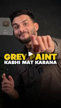 a man pointing at the camera with his thumb up and text grey paint kashi mat karana