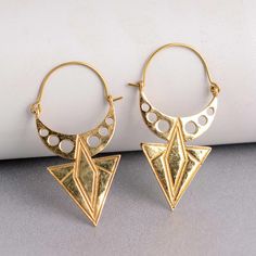 "Gold Brass Earrings, Brass Triangle Earrings, Triangle Hoop Earrings, Bohemian Festival Jewelry, Geometric Earrings, Brass Boho Earrings Handmade Earrings Material:- Brass IMPORTANT NOTE....👇 1 product free gift on purchase of 3 products. You can choose the plain brass ring free gift as your wish. Take a screenshot of plain brass ring you like from my shop and send me a photo in personal message. MUST READ....👇 5 stars is my shop's priority. So contact me before leaving any negative review. I Bohemian Brass Hoop Earrings For Party, Gold Bohemian Hoop Wrap Earrings, Bohemian Hoop Earrings For Party, Geometric Hoop Earrings As A Gift, Geometric Hoop Earrings Gift, Pierced Bohemian Hoop Earrings For Parties, Bohemian Gold Wrap Earrings For Festival, Gold Bohemian Wrap Earrings For Festivals, Bohemian Metal Hoop Wrap Earrings