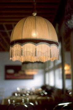 a chandelier hanging from the ceiling in a restaurant