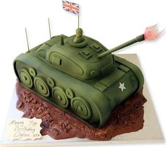 a cake shaped like a tank with an australian flag on top and the number one on it