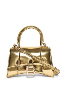 gold-tone calf leather polished effect single top handle adjustable detachable shoulder strap foldover top with magnetic fastening gold-tone hardware main compartment internal logo patch Learn more about what makes a product Conscious on our Conscious Criteria page Balenciaga Hourglass Bag Silver, High-end Gold Top Handle Bag, High-end Gold Bag With Top Carry Handle, Gold Leather Shoulder Bag With Top Carry Handle, High-end Gold Bags With Top Carry Handle, High-end Gold Bags With Double Handle, Modern Yellow Gold Bag With Gold-tone Hardware, High-end Gold Bag, Yellow Gold Rectangular Shoulder Bag With Gold-tone Hardware