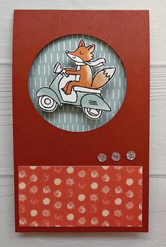 a card with an image of a fox on a scooter