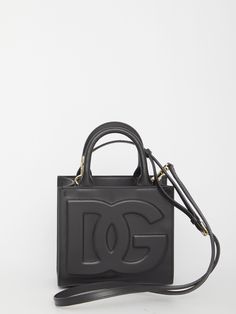 DG Daily mini tote bag in black calfskin with tonal embossed DG logo on the front. It features fixed double handles, adjustable and detachable shoulder strap, one main interior compartment, one interior zip pocket and one interior slip pocket.Dimensions: 17,5x16,5x9cm Size nationality: UNI Product number: 31448683 Product code: BB7479AW57680999 Composition: 100% calfskin Everyday Calf Leather Bag With Logo, High-end Top Handle Bag With Logo, High-end Rectangular Shoulder Bag With Logo, Designer Rectangular Satchel With Logo, Luxury Rectangular Shoulder Bag With Embossed Logo, Formal Satchel Bag With Logo, Luxury Logo Satchel Shoulder Bag, Luxury Logo Tote Shoulder Bag, Luxury Satchel Shoulder Bag With Logo