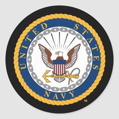 the united states navy seal with an eagle and anchor on it's front side