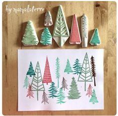 christmas trees made out of rubber stamps sitting on top of a piece of paper