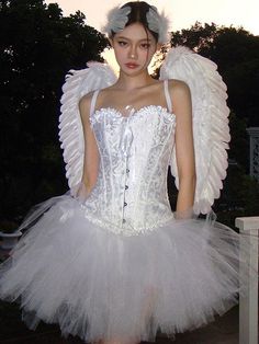 a woman in a white corset with angel wings on her head and dress