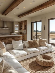 a living room filled with lots of white furniture