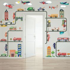 an open door leading to a room with cars and planes on the road wall decals