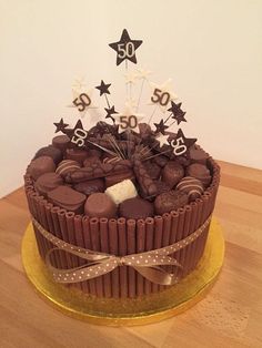 a 50th birthday cake with chocolate and white stars